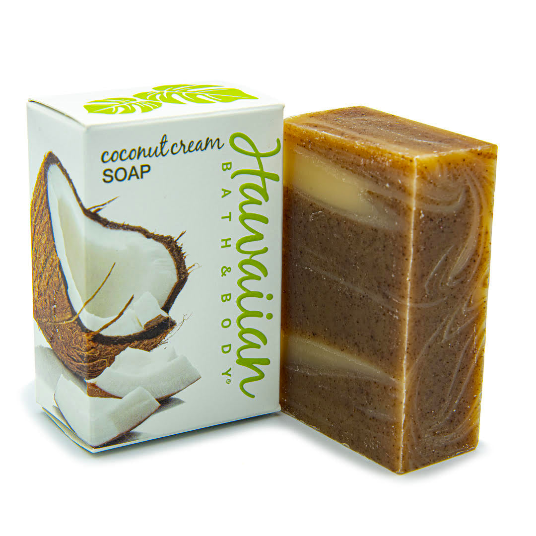 white box printed with a cracked open coconut, next to a bar soap with brown clay swirls - Hawaiian Bath & Body®