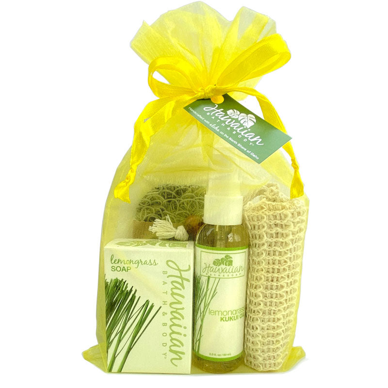 Set of lemongrass-themed products including soap, spray bottle, and basket, all tied with yellow ribbon and green tag on white background.